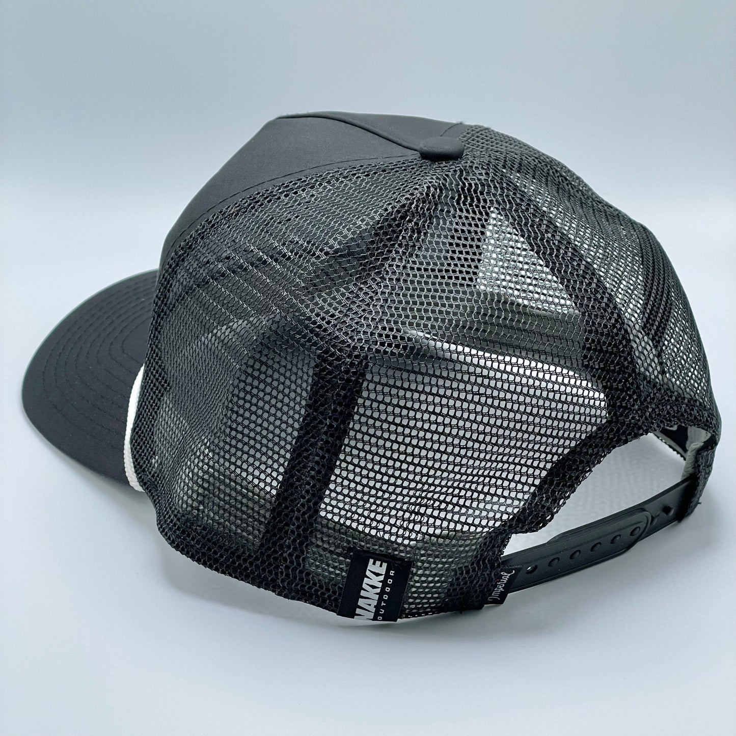 Black 5 panel retro fit mesh back hat with a white embroidered duck on the front