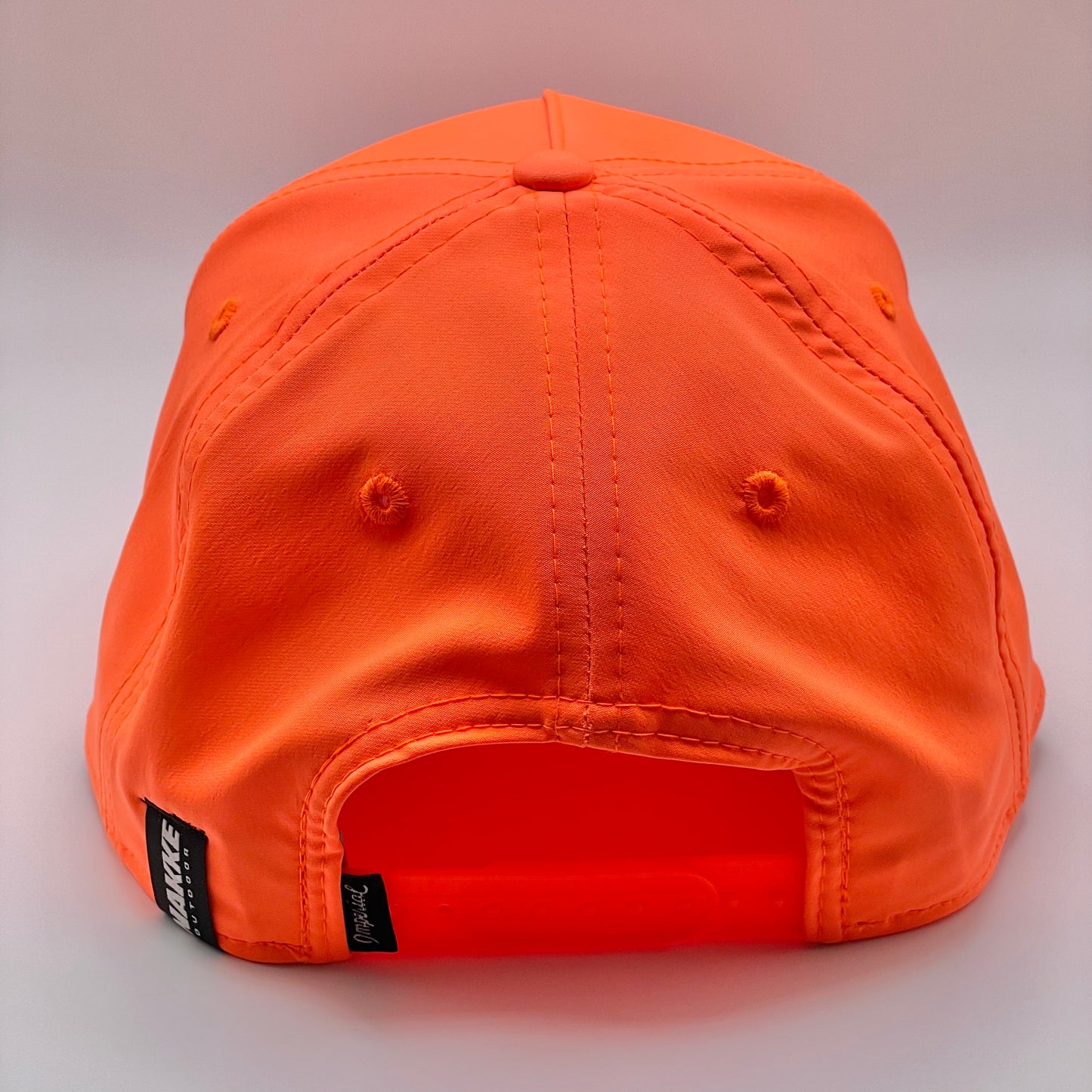 Neon Orange Retro Fit Hat with a black embroidered fish and white woven rope