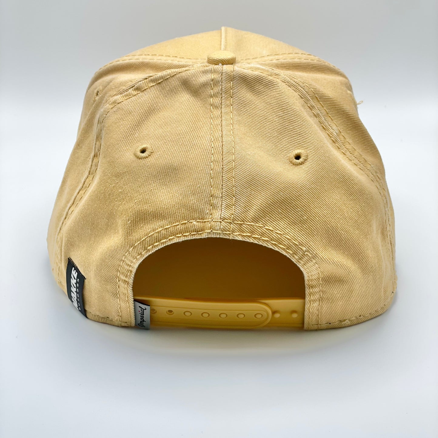Pigment Washed Cotton Twill 5 Panel “Honey” Colored Hat with Embroidered Bass on the front and a black rope running along the base