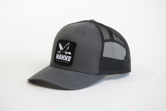Black and Grey Mesh Back Trucker Hat with Nakke Drake Logo Patch